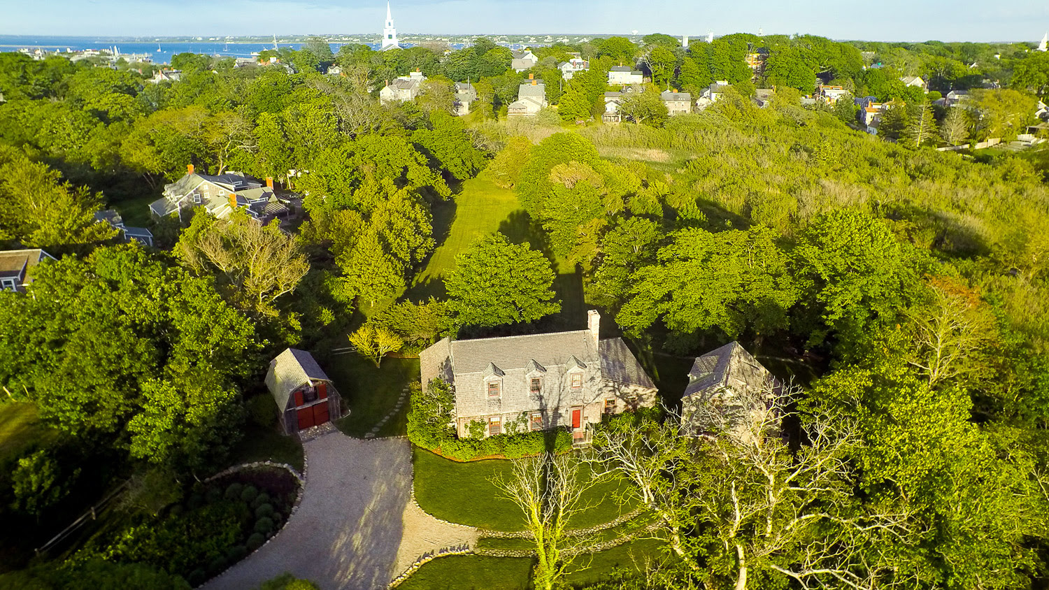 Aerial view of the house, cottage, and barn at 6 Wesco Place